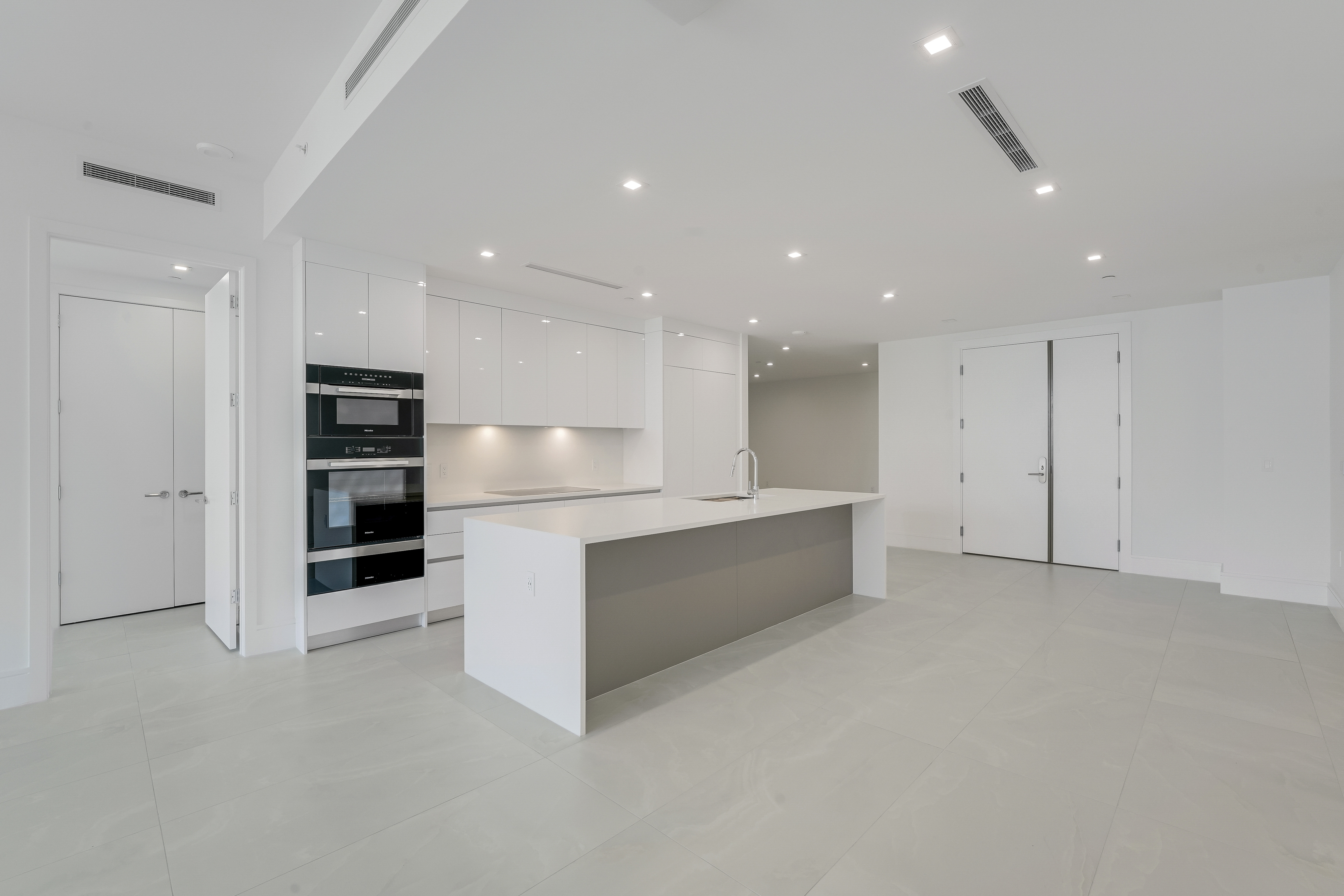 Kitchen and private entry area in Executive 704