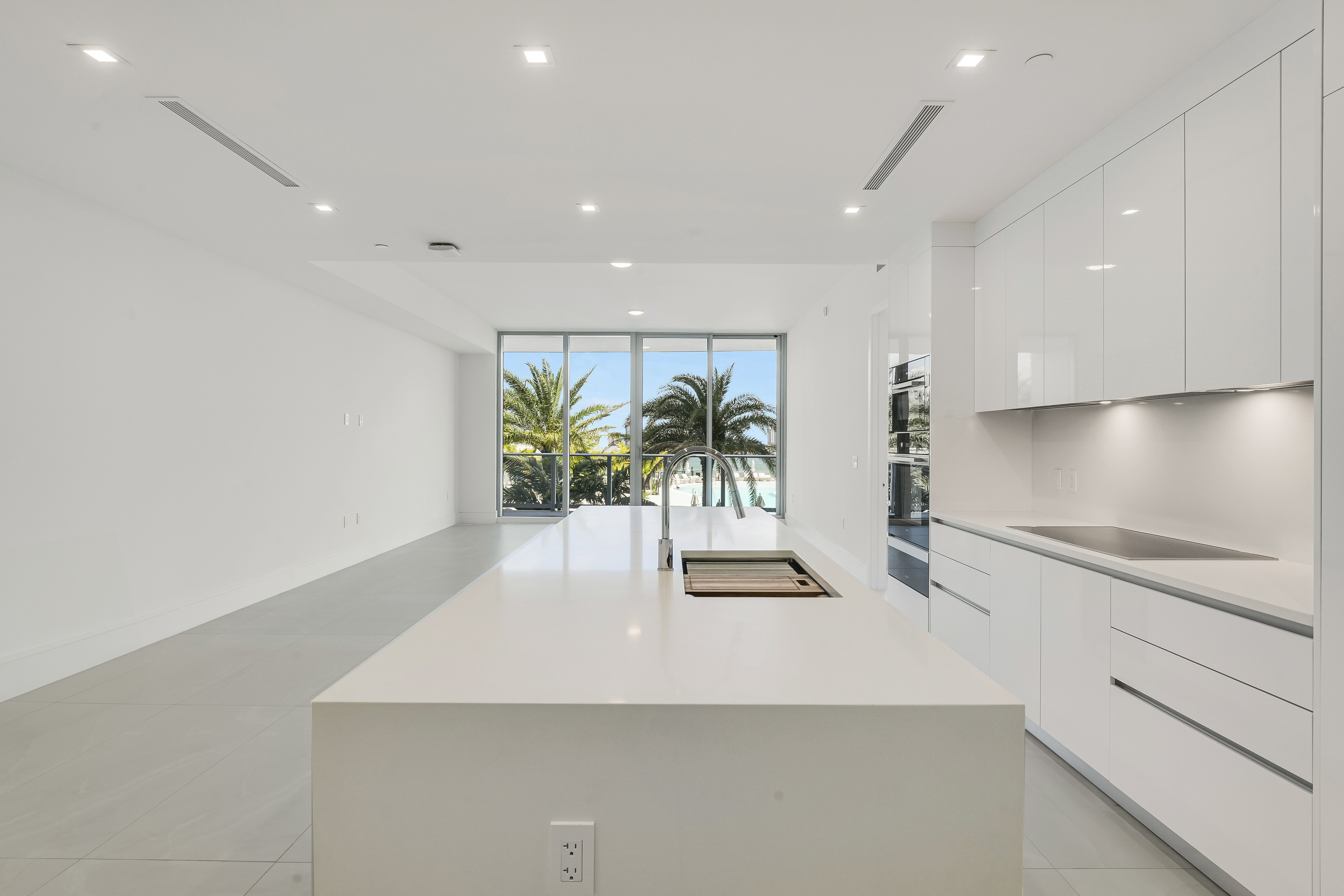 Kitchen island looking toward the terrace and pool in Executive 704
